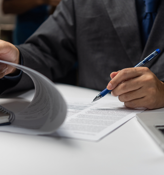 A businessperson reviews interest rate swap and loan contract documents, emphasizing negotiation