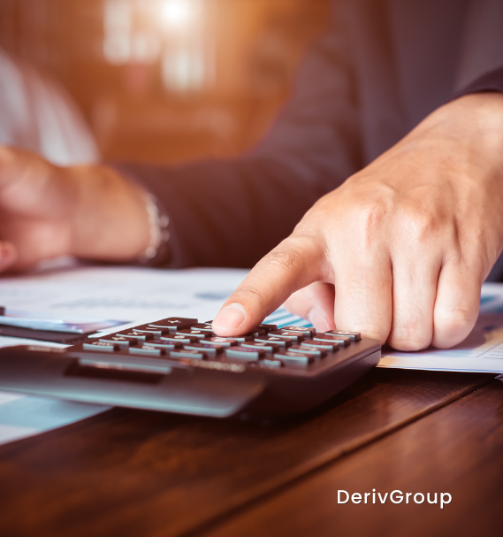 A calculator and financial documents showing interest rate calculations for loan management