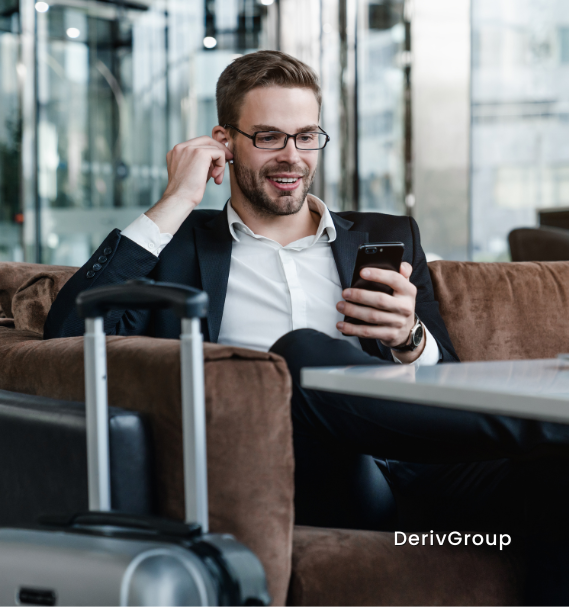business professional managing foreign currency hedging from a laptop while traveling, ensuring global financial stability